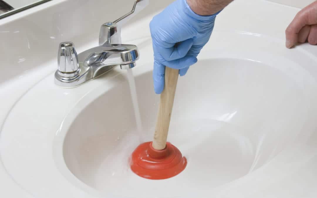 clog in driain between bathroom tub and kitchen sink